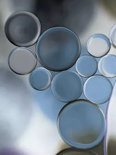 abstract circles in clear, black, and gray colors.