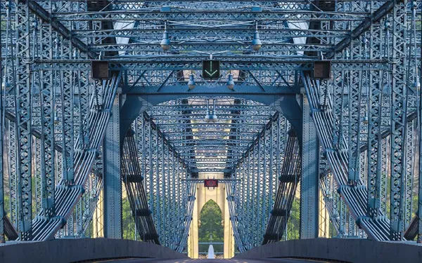 Intricate beams of a steel bridge.