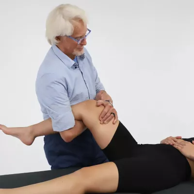 Massage therapist Erik Dalton works on a hip decompression with a client.