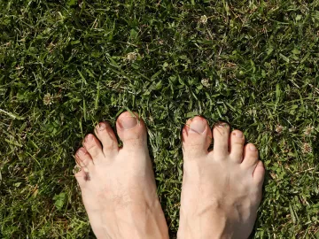 Bare feet on grass.