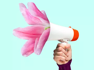 Upraised human arm holding bullhorn.