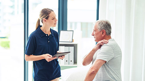 Image of a person doing intake on a client.