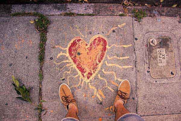 Overhead vew of chalk art in the shape of a heart 